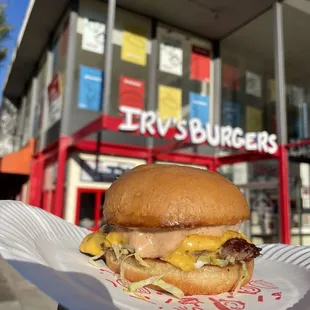 Just for you burger with a little lettuce on a plain bun.  Best burger for its price in town