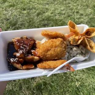 Combo plate with huli huli fried teriyaki chicken and fried shrimp, rice, macaroni salad, and a crab Rangoon