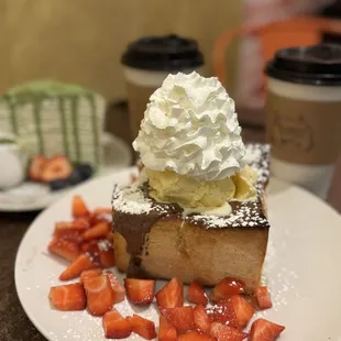 Honey bread with strawberries, Nutella, and ice cream.
