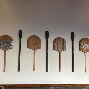  paddles on the wall