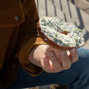 a person holding a doughnut