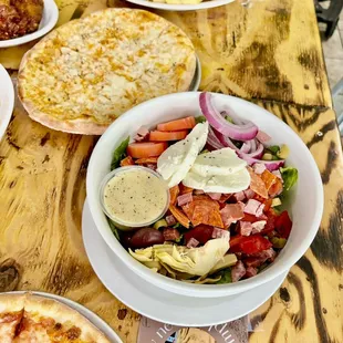 a variety of pizzas and salads
