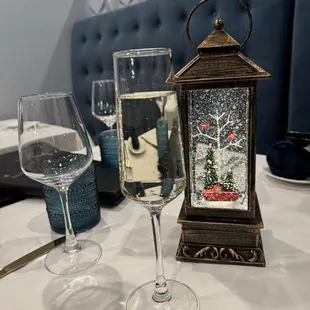 Cute table decor for Christmas. Every table had a swirling lit up glitter lantern -