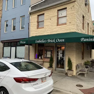 a car parked in front of a restaurant