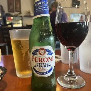 Peroni Italian beer and glass of Chianti red wine