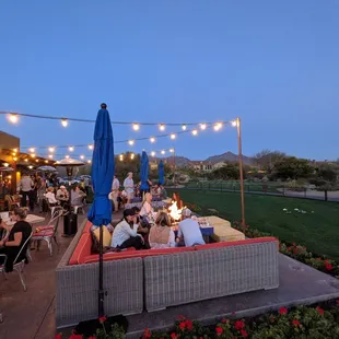 a group of people enjoying a meal outdoors