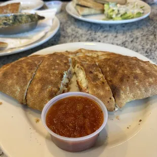 Make your own calzone: margherita pizza toppings with side of marinara (and spinach dip in the background)