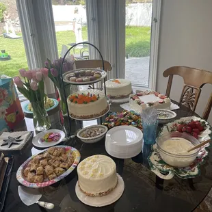 Dessert of lemon cake on the far upper right with strawberries on top.