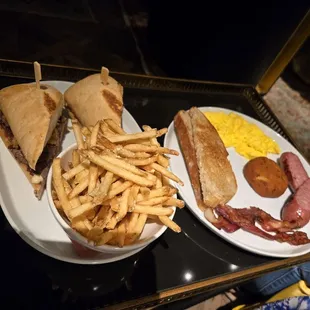 Steak sandwich and breakfast plate