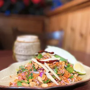 Naem Khao Tod: Spicy Salad of Curried Rice Croquettes w/ fermented pork, ginger, peanuts | $12.50 + $3 sticky rice