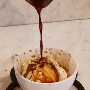 a bowl of ice cream and caramel