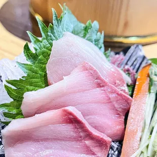 a plate of raw meat and vegetables