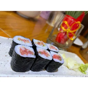 a plate of sushi rolls