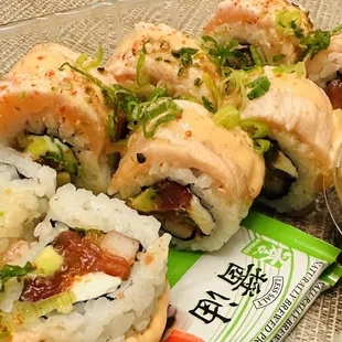 Internal Combustion - Spicy tuna, krabstick, topped with torched belly it of tuna, 7-spice, baku sauce, dehydrated jalapeno, and scallions