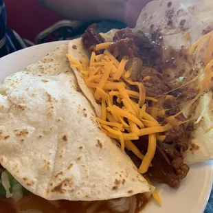Carne guisada taco with cheese and bacon