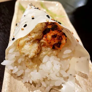 a close up of a sushi with rice