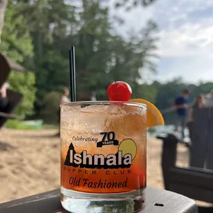 a drink with a cherry on top