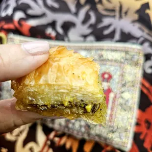 a hand holding a pastry