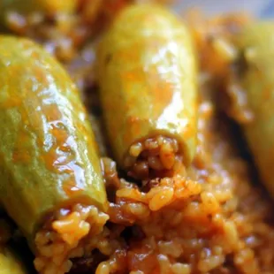 Ma7ashie zucchini inside basmati rice with fresh tomatoes.carlic.onine  souse and olive oil.