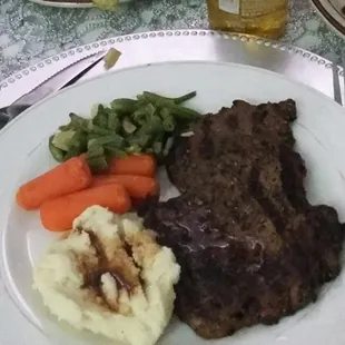 Hard mashed potatoes, canned vegetables, and a sorry excuse of a &quot;12 ounce ribeye&quot;