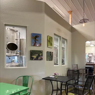 a dining area with a table and chairs