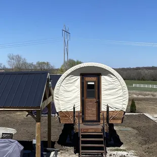a covered wagon in a field