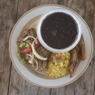Ropa Vieja with cuban yellow rice, black beans and Maduros