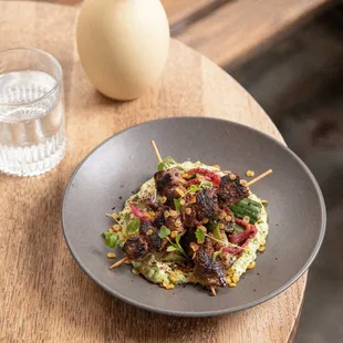 Kangaroo Tucker. individual skewers of succulent kangaroo tenderloin encrusted with traditional Australian spice rub, over a bed of herbed t