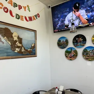 a table and a tv in a restaurant
