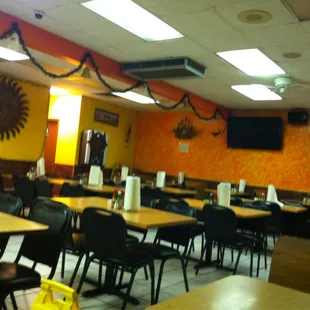 a restaurant with tables and chairs