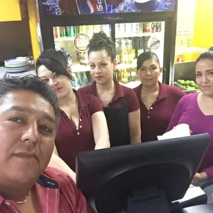 a group of people behind a computer