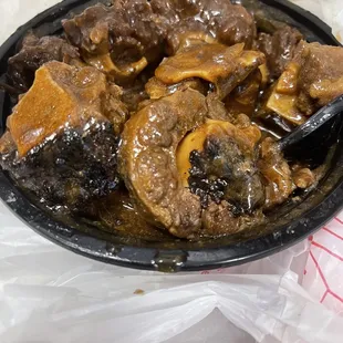 a bowl of beef and mushrooms