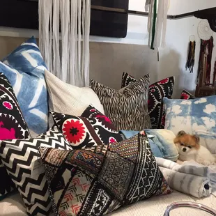 I spy Pierre da Pom! Bed of beautiful textiles!