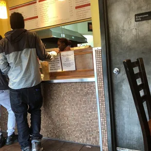 Front desk from the stools on the right.