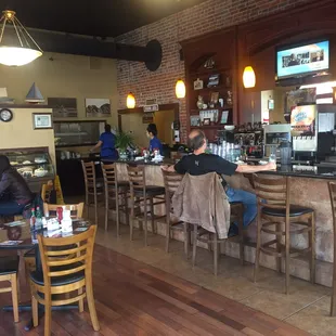 View of bar/restaurant from entry door. A hostess seats you.