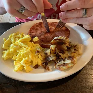 Ham steak and scrambled eggs