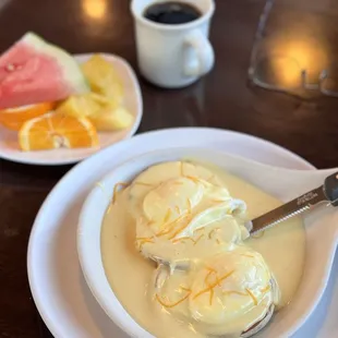 Eggs Benedict with ham. Fruit instead of hashbrowns