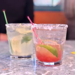 two cocktails on a table