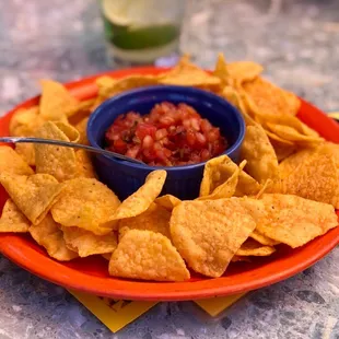a plate of chips and salsa