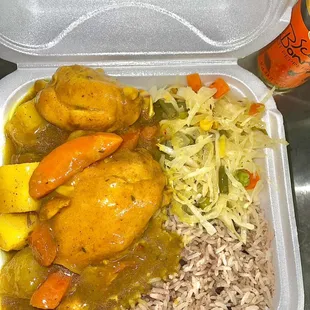 Curry chicken with rice and peas and steam cabbage