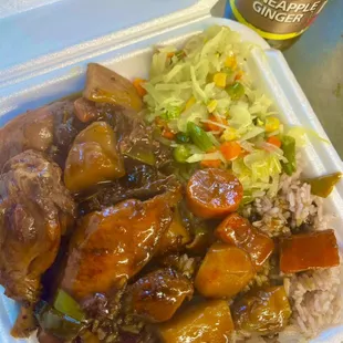 Brown stew chicken with rice and peas and steam cabbage