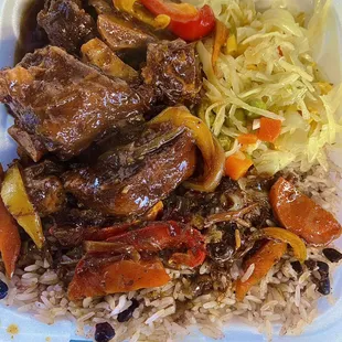 Oxtail with rice and peas and steam cabbage