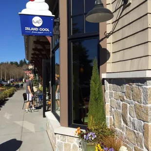 a woman walking down the sidewalk