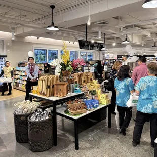 Managers greet customers at grand opening.