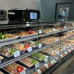 Salads, pizzas, 8 varieties of poke in the deli counter.
