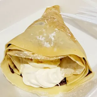 An absolutely delicious Nutella crêpe. The ice cream &amp; whipped cream were to die for.