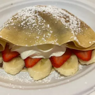 Strawberry, banana, Nutella, whip cream crepe.
