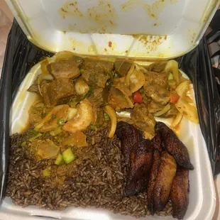 curry goat plate with rice and peas and plantain