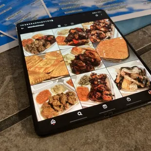 a photo of a tablet with a menu in the background