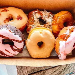 a variety of doughnuts in a box